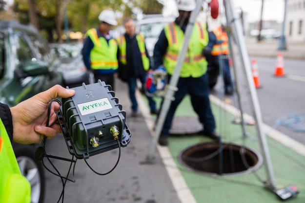 Installing sensors to monitor sewer lines underneath the streets of San Francisco