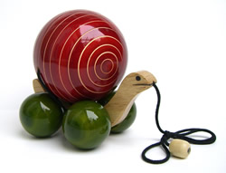 The Internet is teeming with online stores, catalogs and environmental groups that sell green-friendly gifts for the holidays. Pictured here: a child's snail pull-toy from Earthentree, made by artisans in India from sustainable wood that is dyed with natural vegetable dyes and finished with lead free non-toxic organic resin.