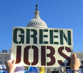 A banner with the words "green jobs" with the US Capital building in the background