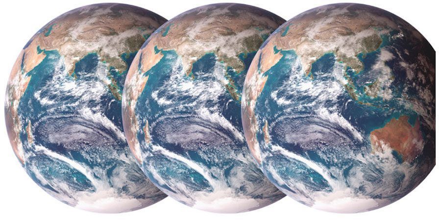 A conceptual image of three Earths offset and superimposed over each other