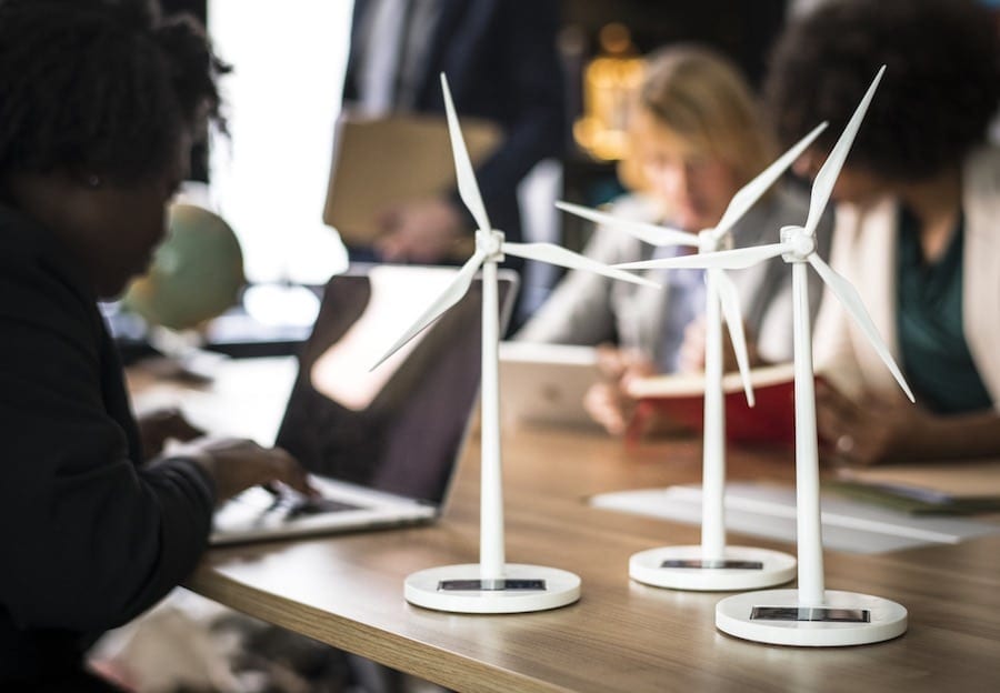 models of wind energy turbines sit on a desk