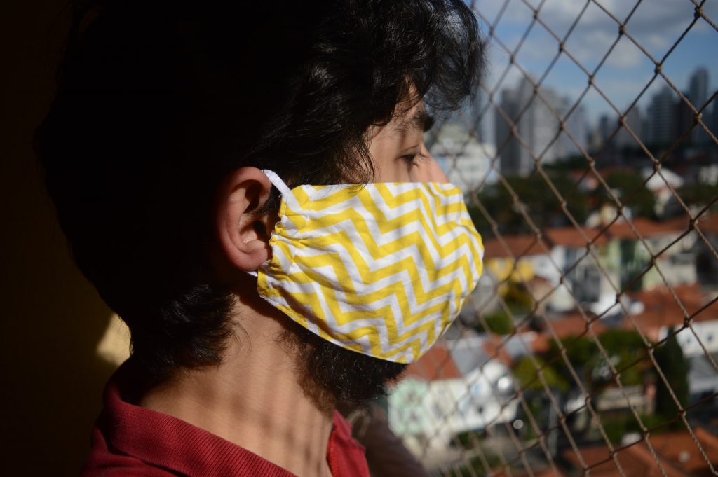 A climate activist wears a face mask